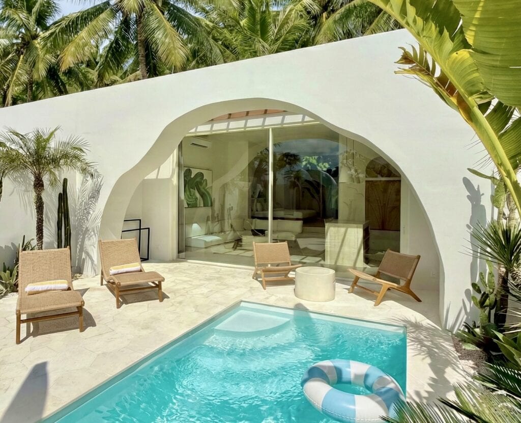 Luxury Bali villa rental featuring a private turquoise pool and sun deck