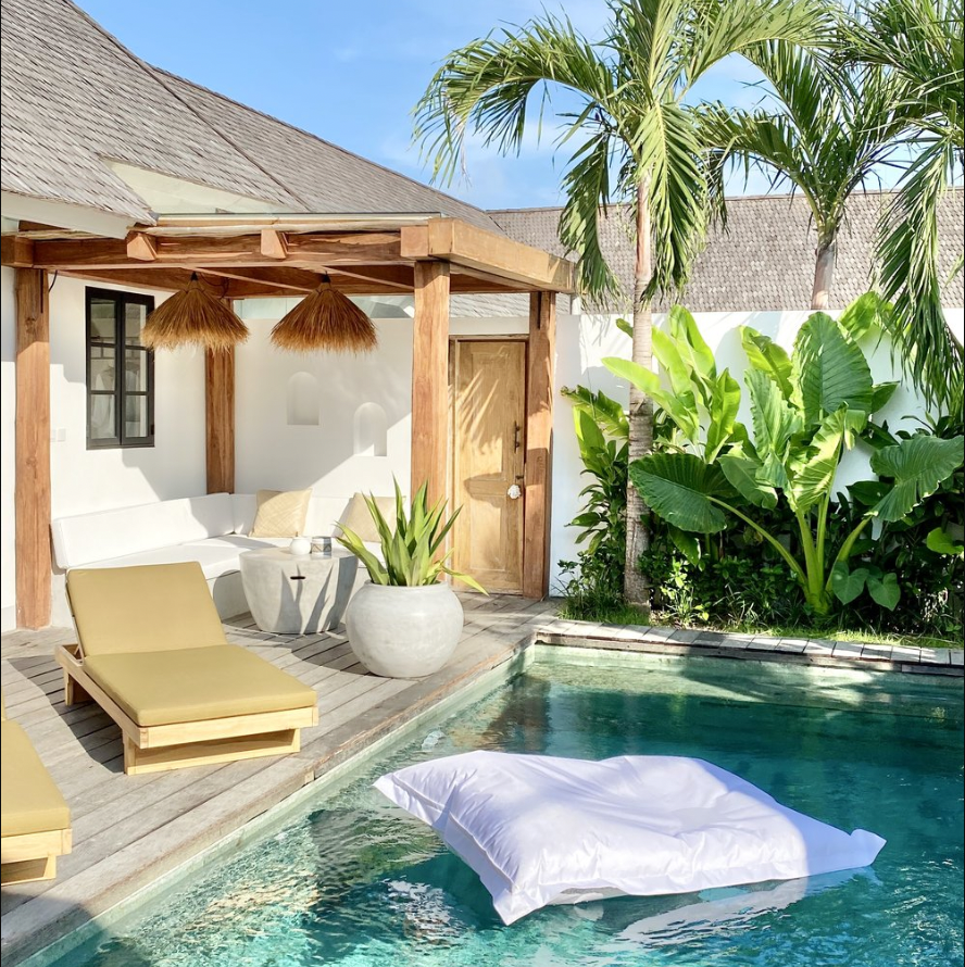 A tropical-modern Bali villa with pool, tropical greenery, and minimalist design in Canggu. Perfect for a luxury getaway.