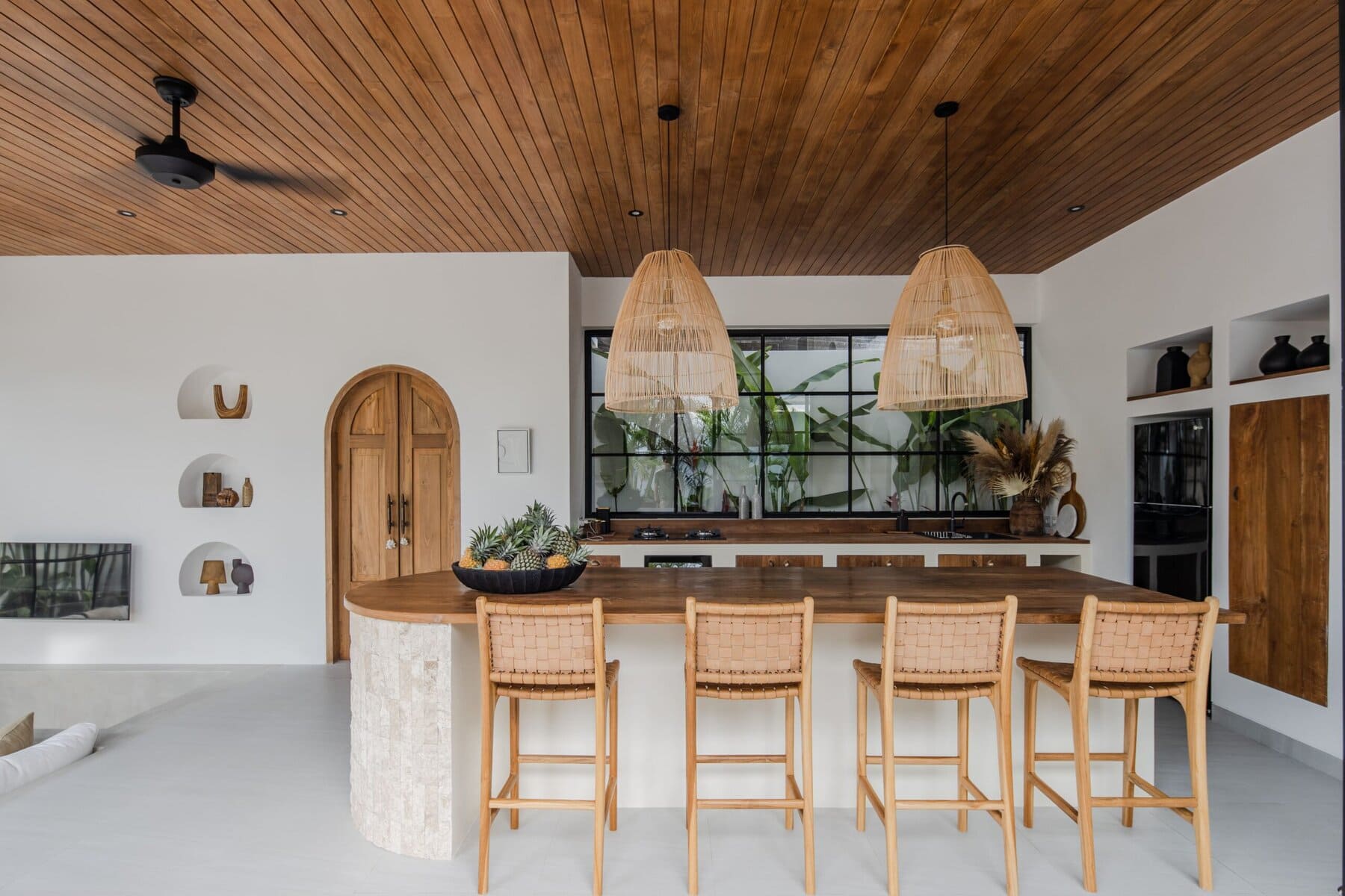 Bright, modern kitchen with wooden accents and tropical decor. Perfect for a stylish Bali getaway.