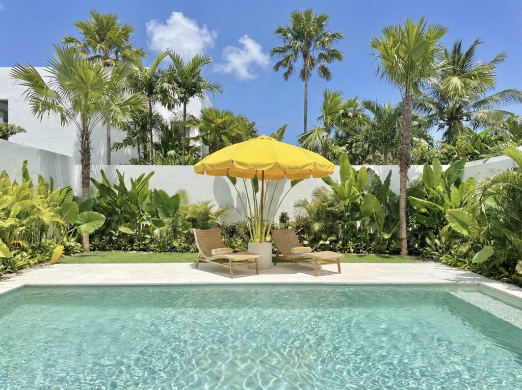 The Young Villas: Elegant tropical-modern villa with a private pool surrounded by lush greenery in U.