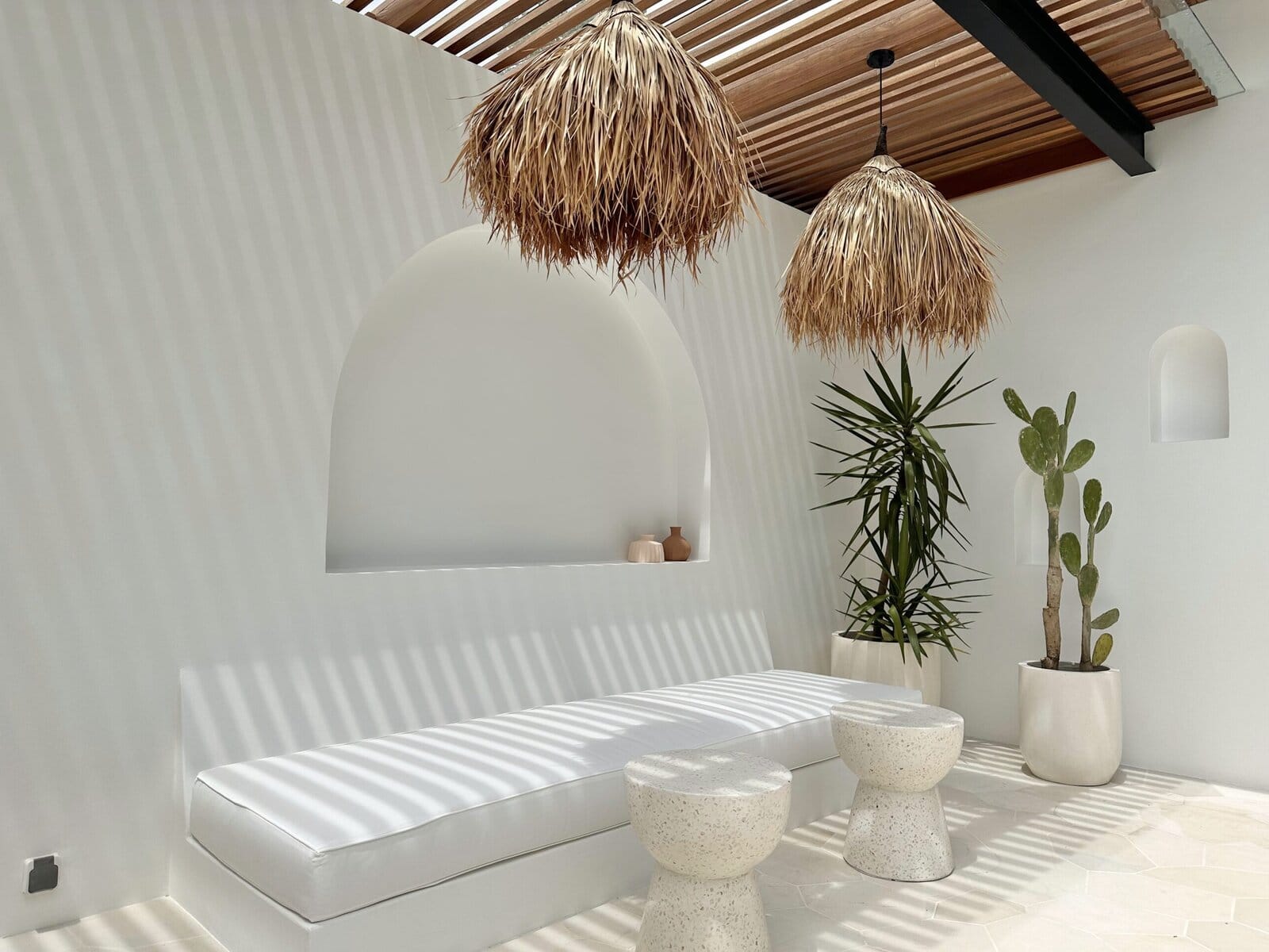 Modern tropical minimalist interior with natural textures and elegant decor.