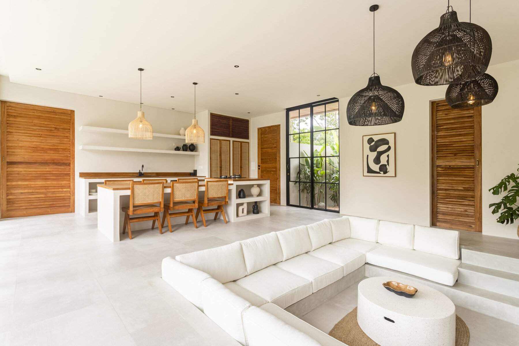 Spacious modern living room with minimalist decor and natural lighting.