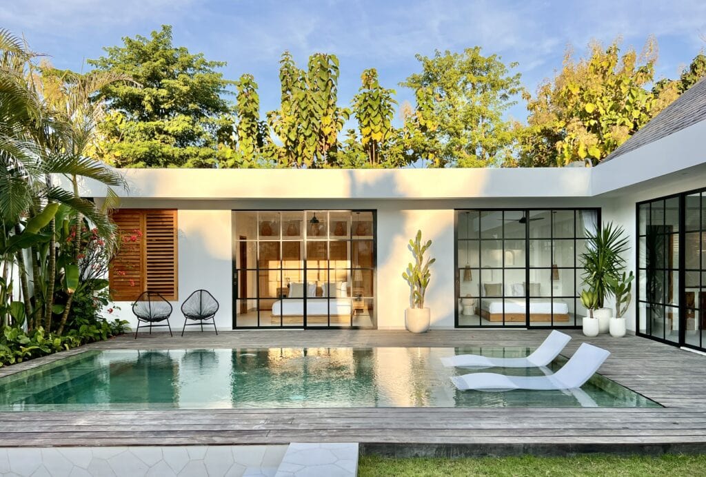 Modern minimalist villa with private pool and lush garden, located in the exclusive Uluwatu region of Bali.