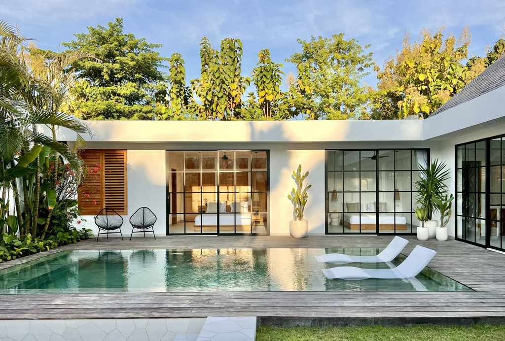 Modern minimalist villa with private pool and lush garden, located in the exclusive Uluwatu region of Bali.