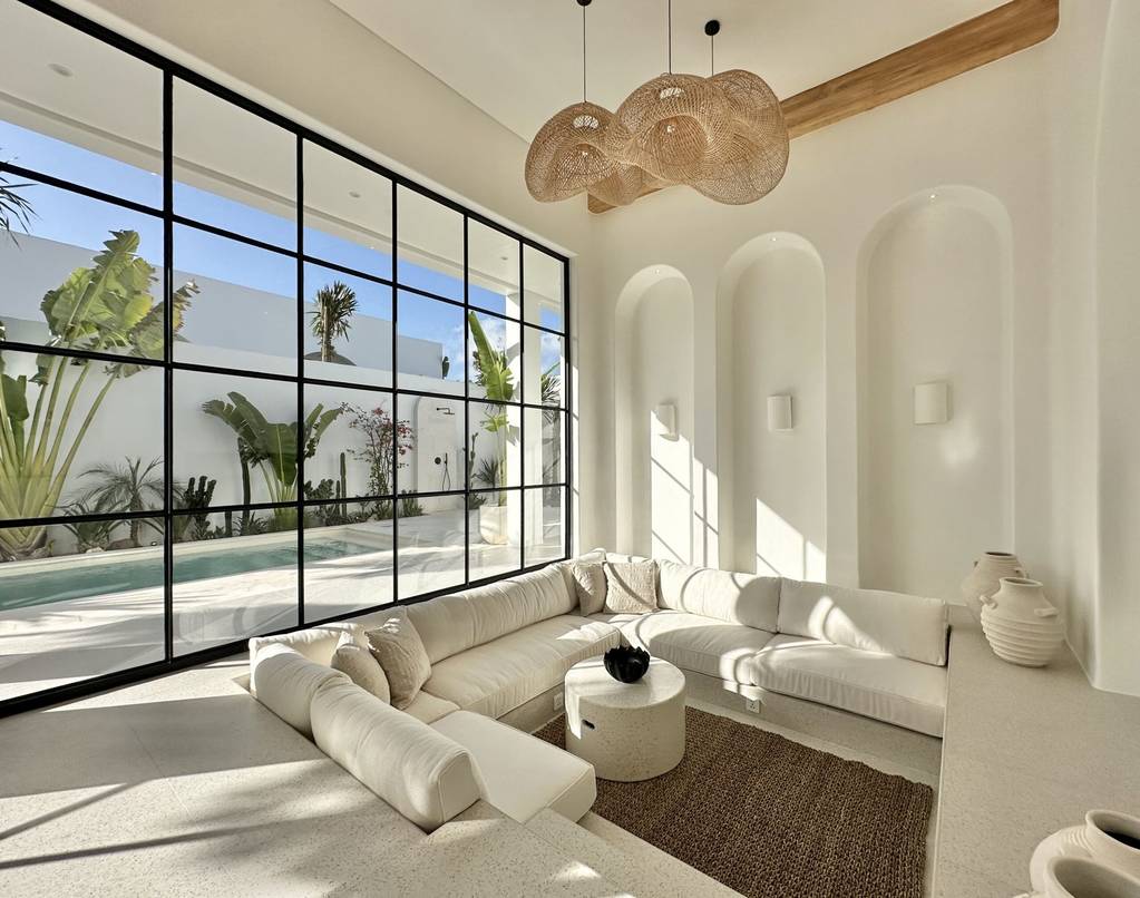 Bright, modern two-bedroom villa with sleek decor and large windows. Ideal Uluwatu retreat.
