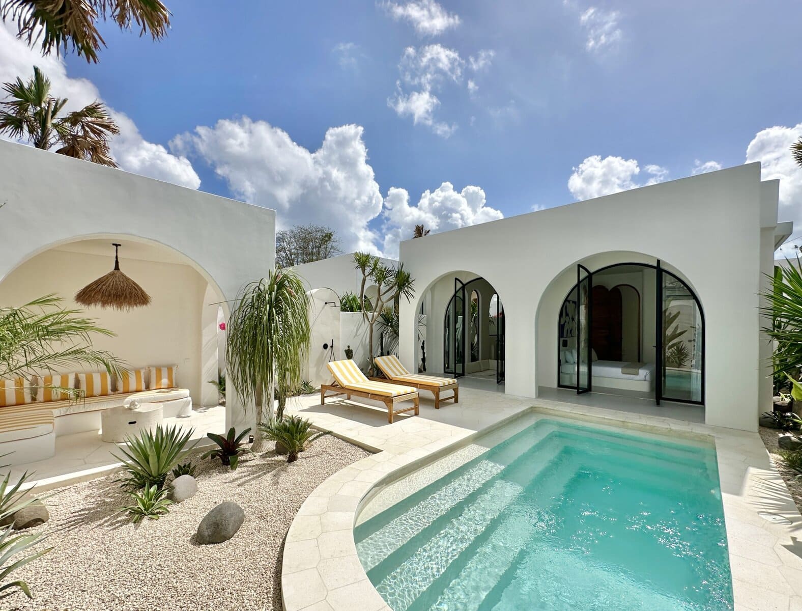 Charming Bali villa with private pool, lush greenery, and stylish modern architecture.