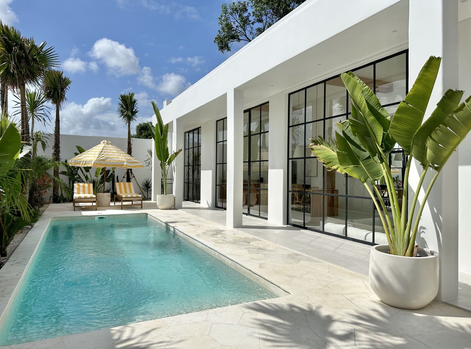 Stunning two-bedroom Uluwatu villa with sleek design, pool, and tropical garden views.