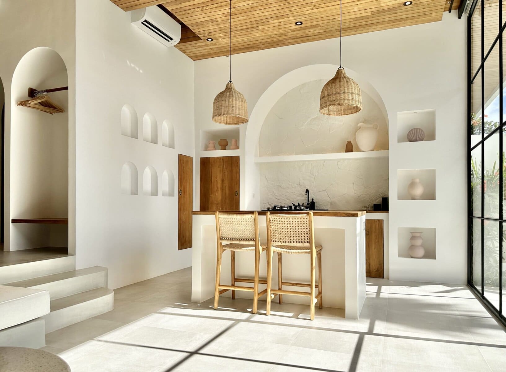 Bright, modern Bali villa with minimalist decor, natural wood accents, and ample sunlight. Perfect for a tropical getaway.