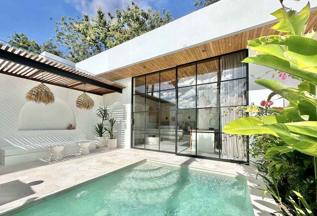 Stylish one-bedroom villa with private pool in Uluwatu, Bali, showcasing modern minimalist design and tropical surroundings.