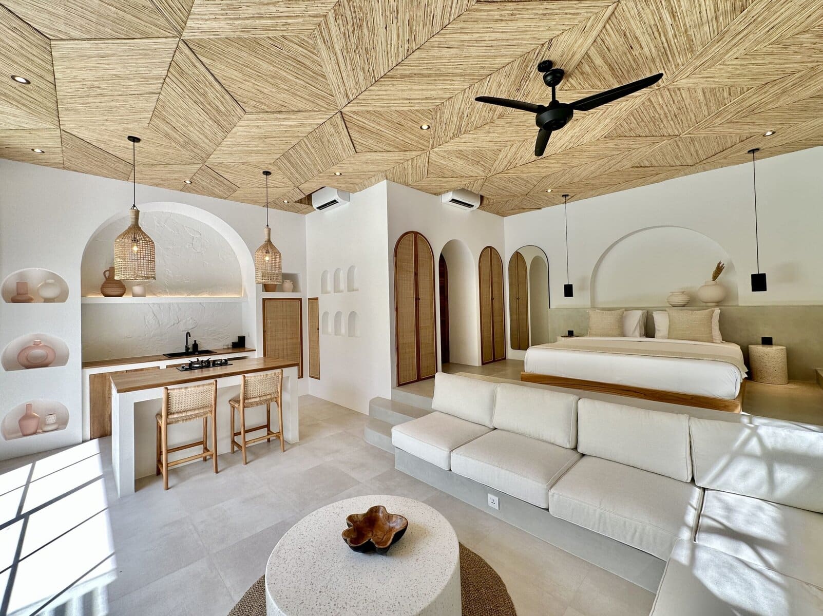 Bright, modern Bali villa with white walls, wooden accents, and minimalist decor, perfect for relaxing stay.