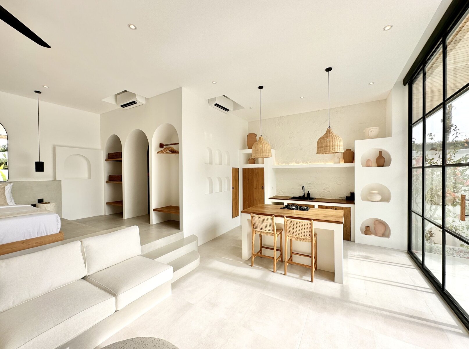 The Young Villas: Elegant, high-end minimalist living space with natural light and modern decor in U.