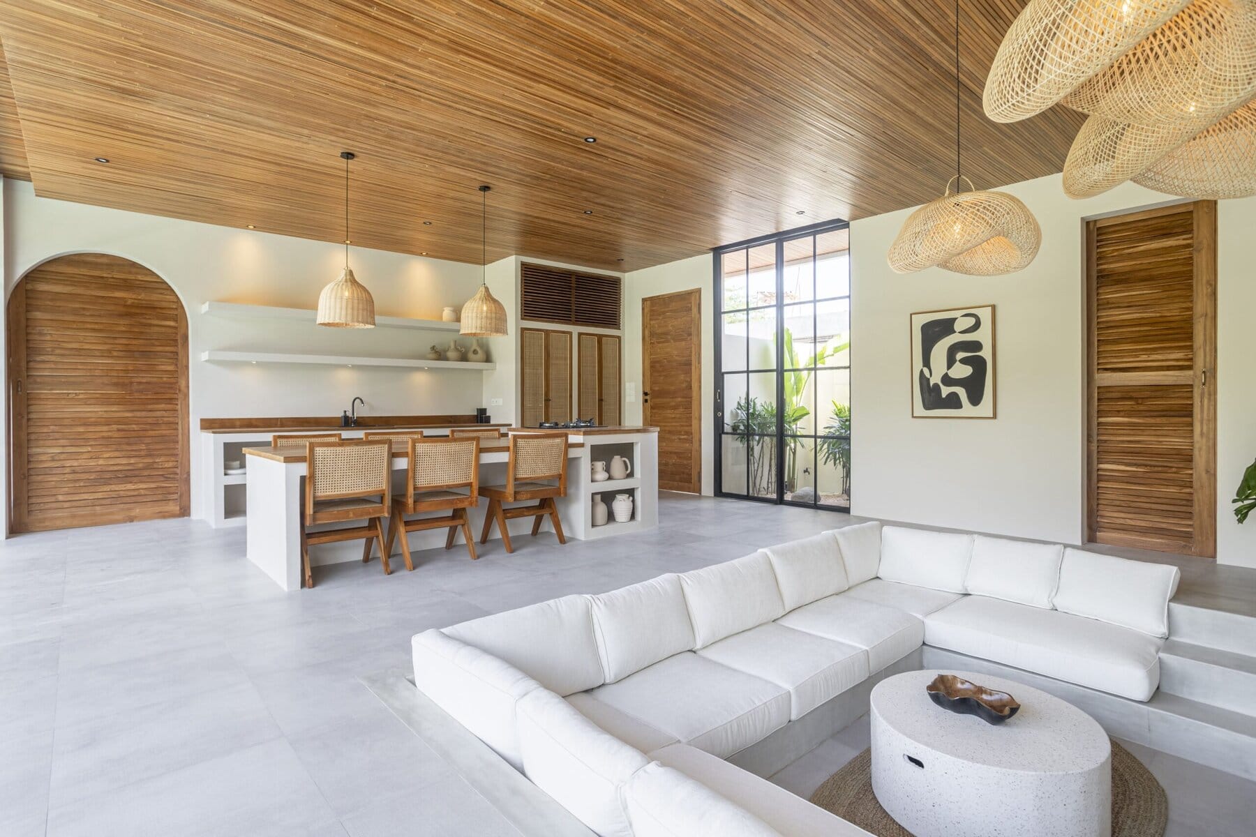 Contemporary Bali villa interior with minimalist decor, wooden accents, and natural light.