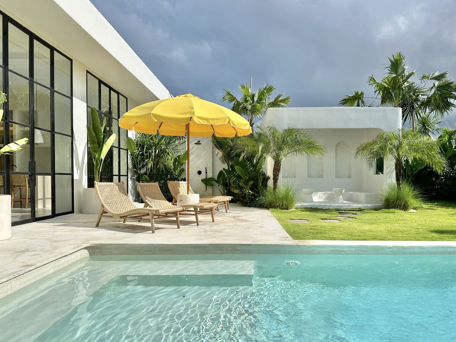 High-end Bali villa with pool, tropical greenery, and minimalist style in Uluwatu's sought-after location.