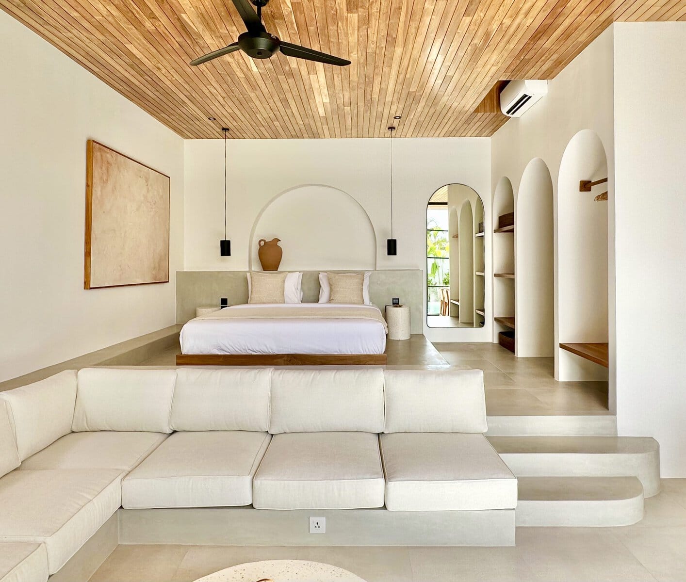Bright, minimal living space with tropical decor in the Bingin Uluwatu villa. Modern design with natural materials and elegant furnishings.