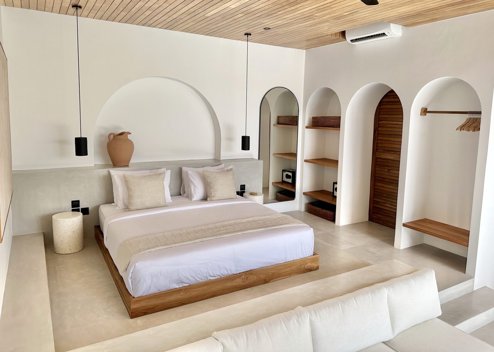 Elegant bedroom with neutral tones and sleek design elements.