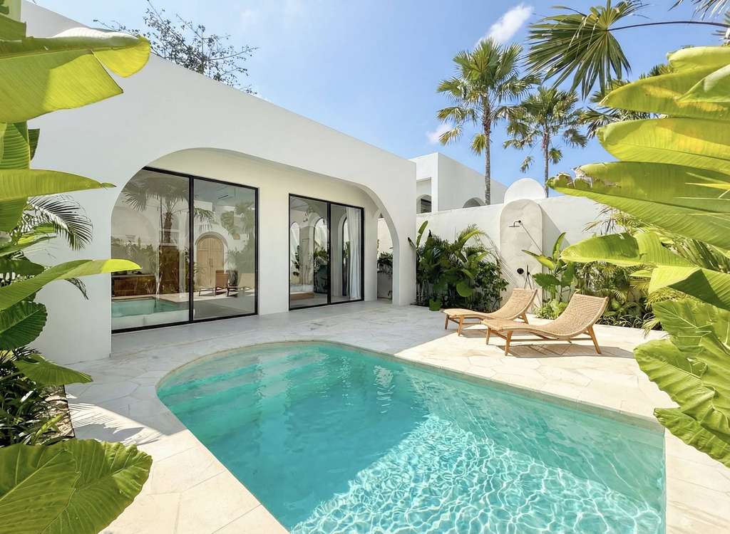 The Young Villas: Luxury tropical-modern rentals in Uluwatu, Bali, showcasing a sleek private pool a.