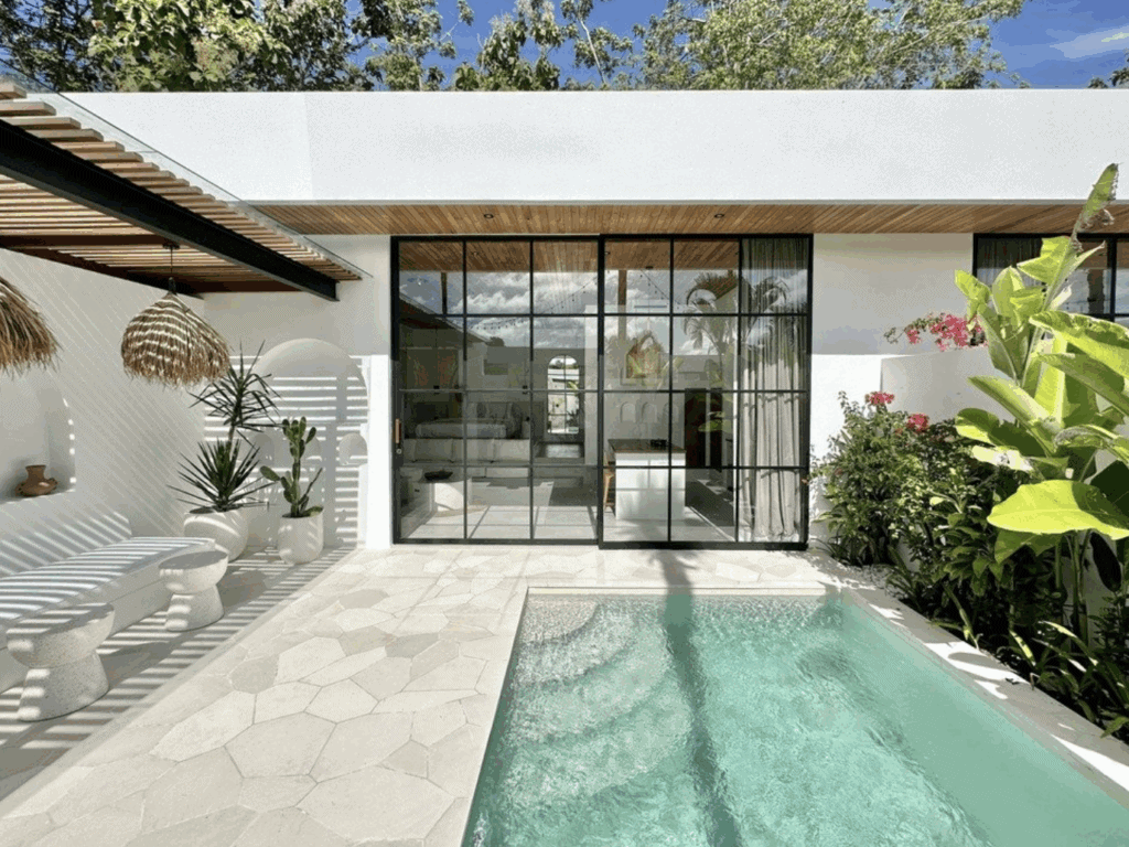 Modern tropical villa with private pool and lush garden in Canggu.