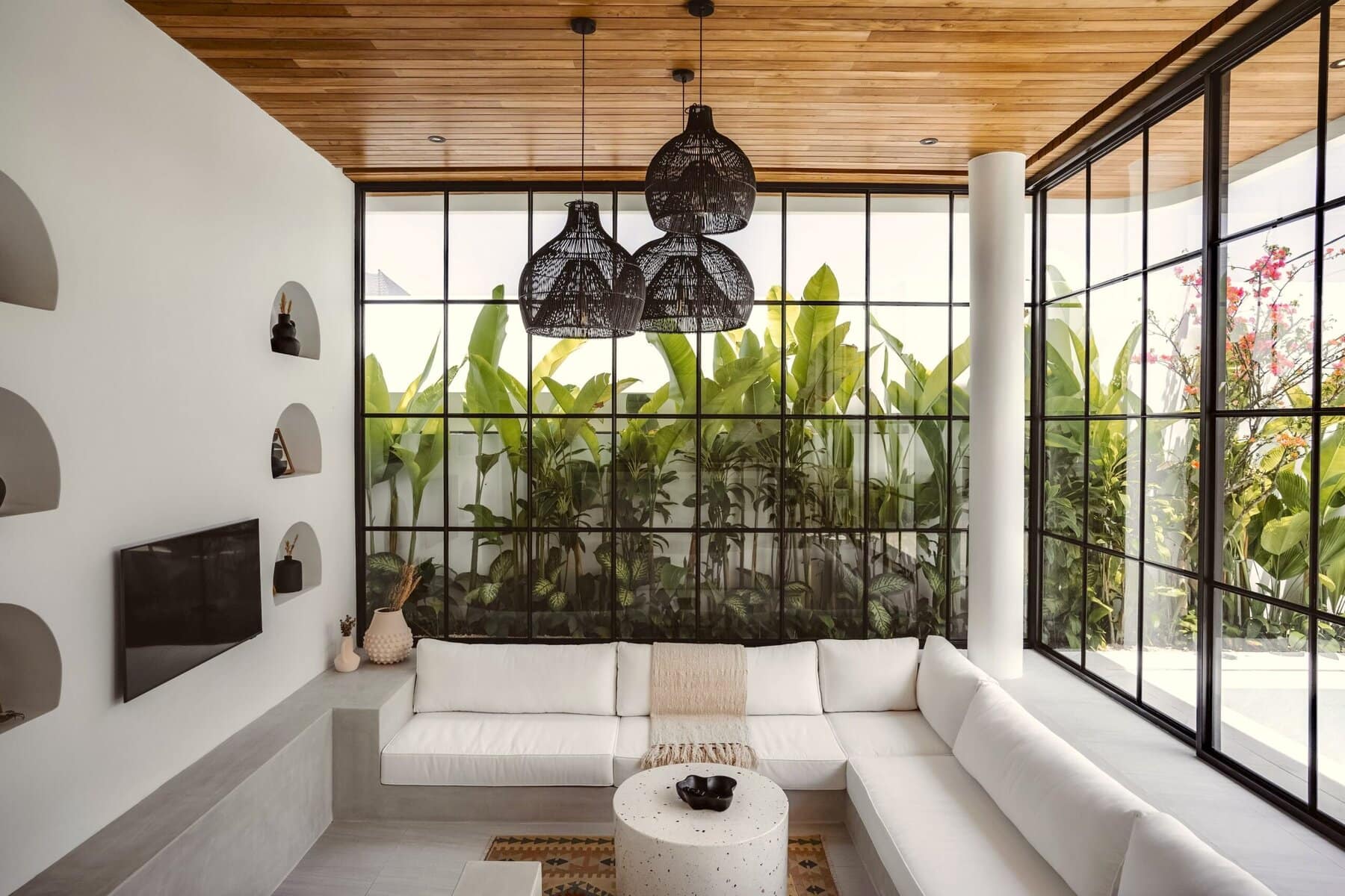 Modern Bali villa with tropical accents, bright natural light, and stylish furnishings.
