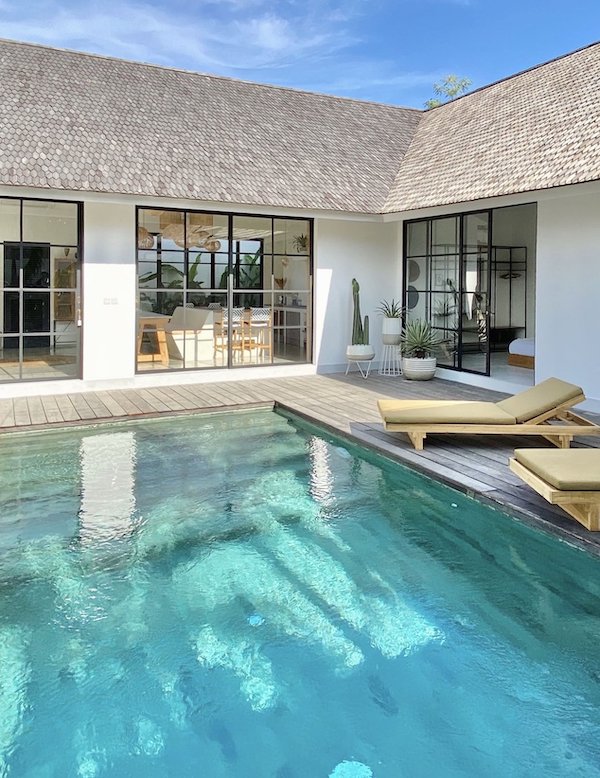 Modern tropical Bali villa with private pool and stylish outdoor lounging.