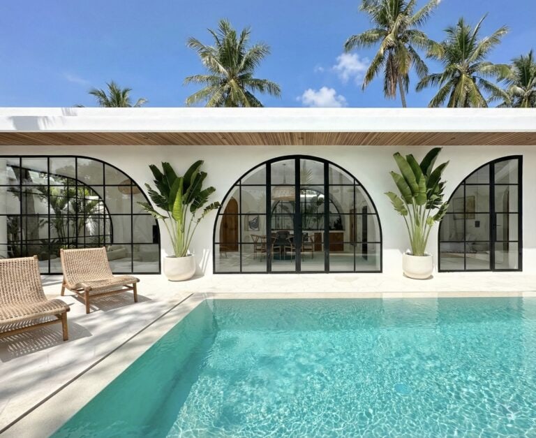 The Young Villas: Luxurious tropical-modern villa with a stunning pool and elegant arches in Uluwatu.