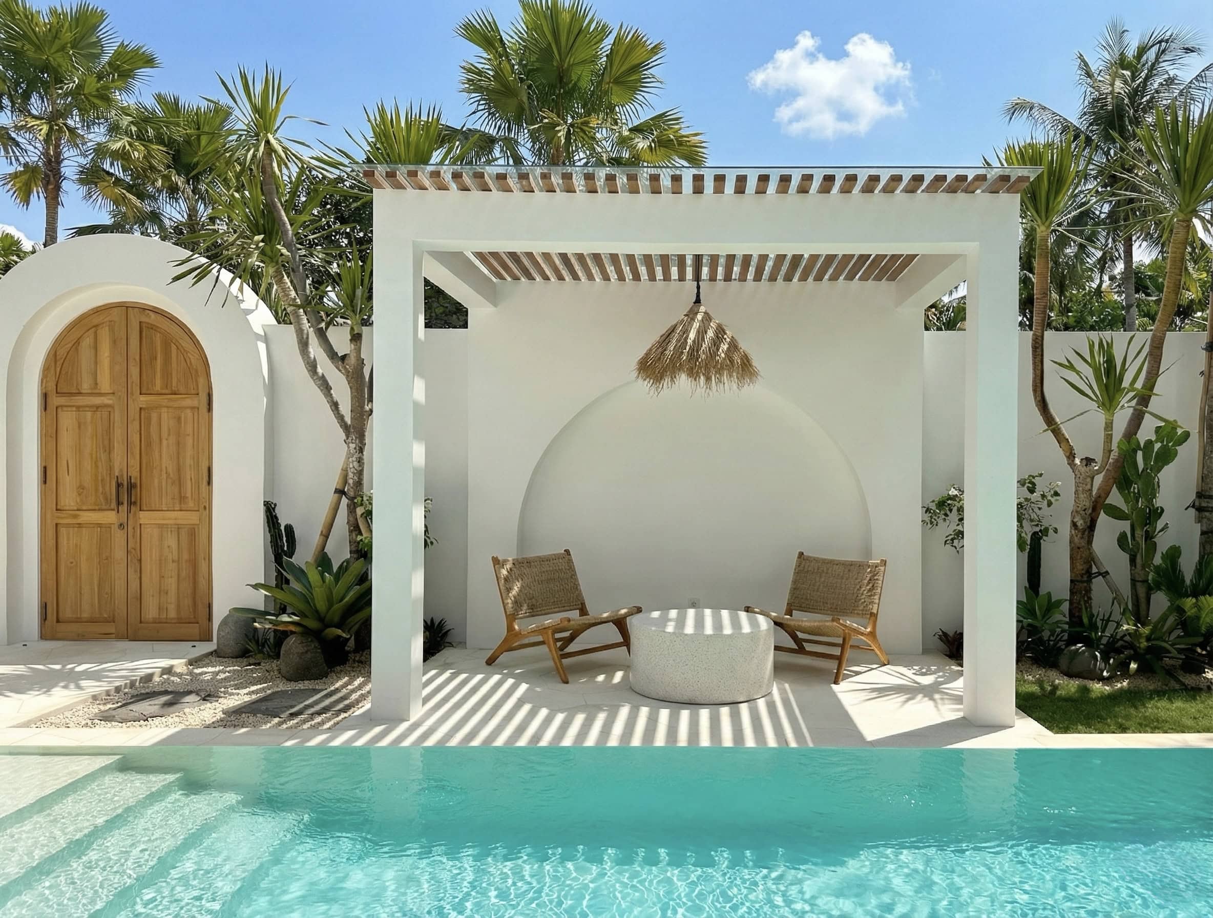 The Young Villas: Luxury tropical-modern rentals in Uluwatu, Bali, showcasing a serene outdoor loung.