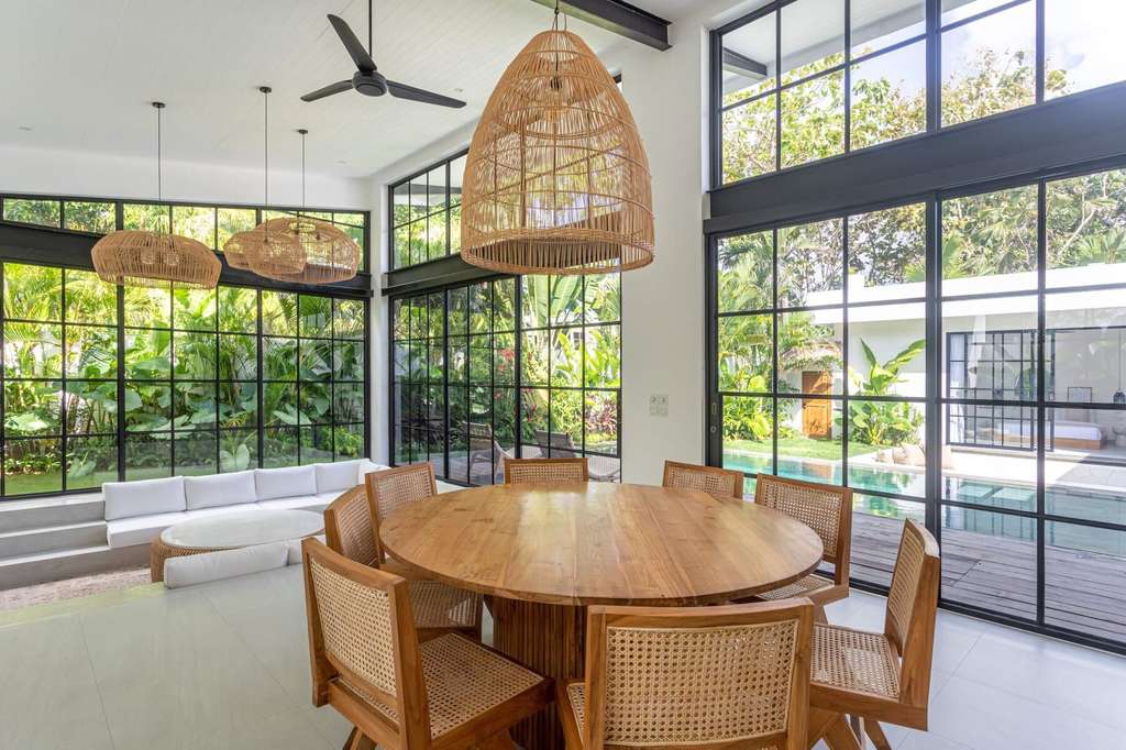Bright modern interior with large glass windows and stylish decor.
