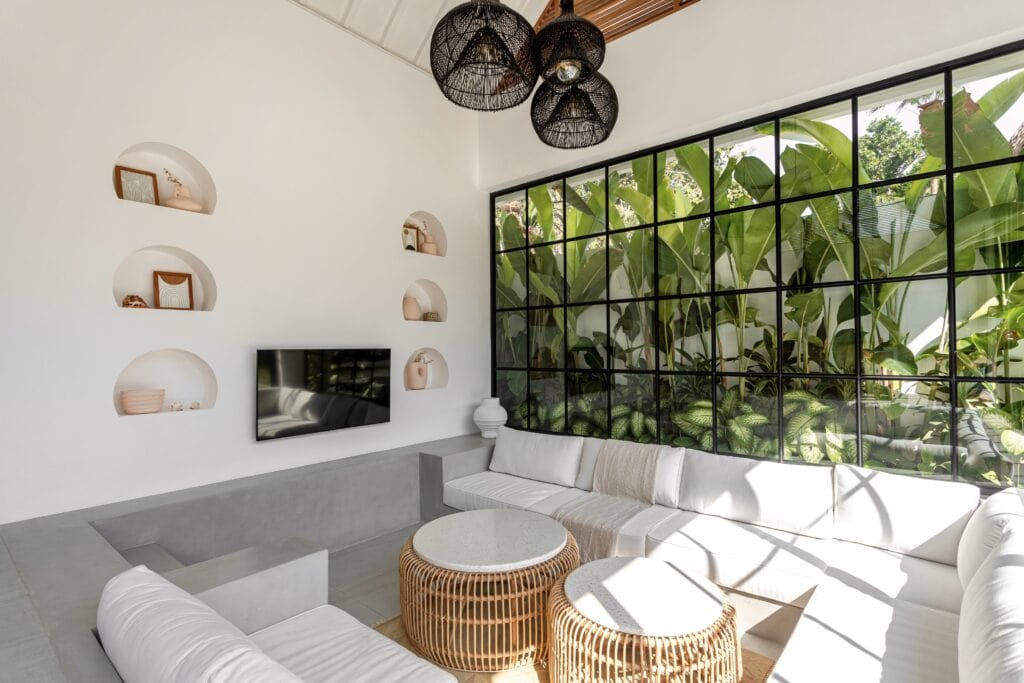 Bright modern interior with lush garden view, perfect for relaxing vacations in Uluwatu.