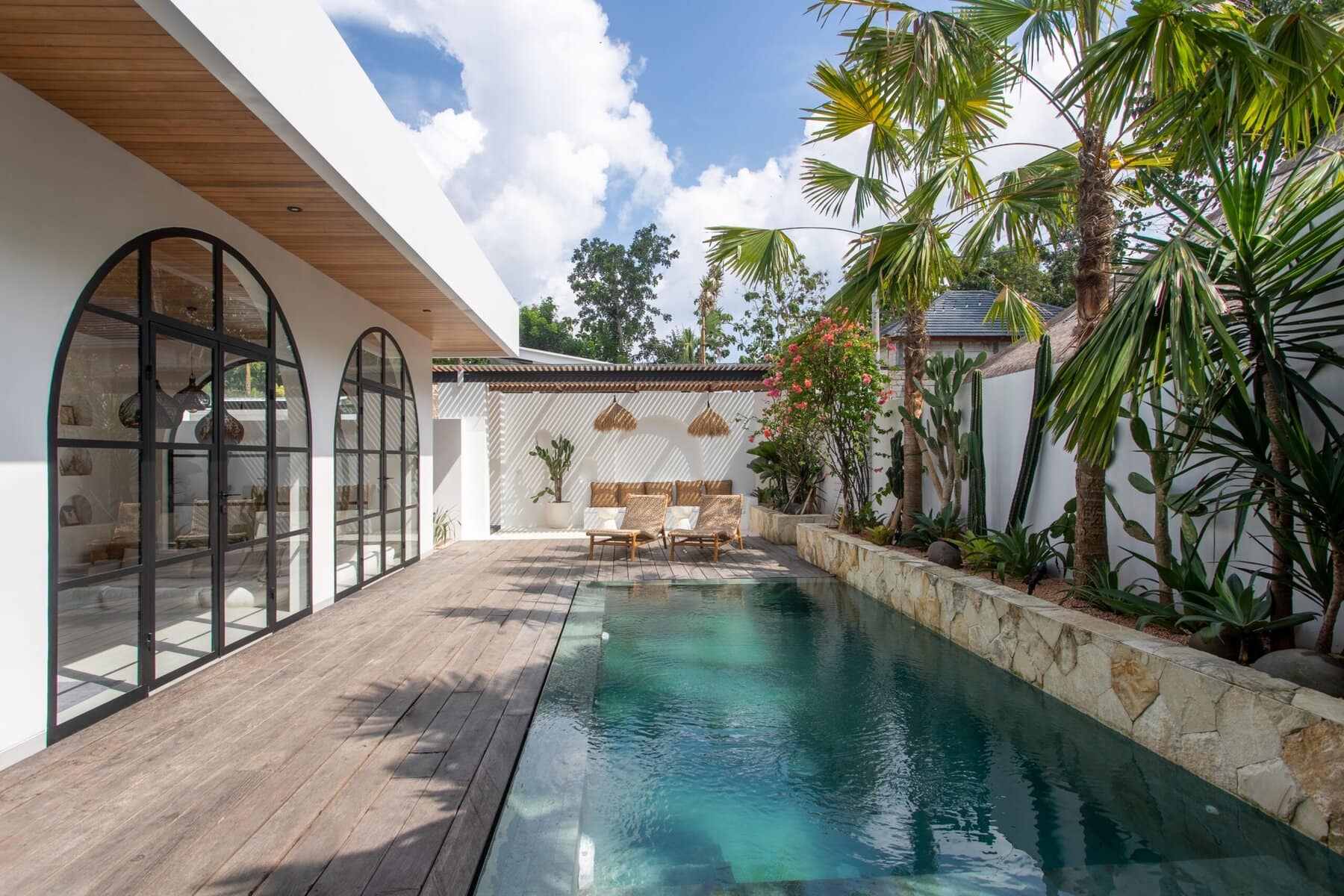 Stunning two-bedroom Uluwatu villa with private pool, modern minimal design, lush tropical landscaping, perfect for a relaxing getaway.