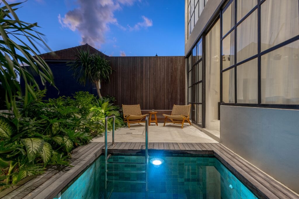 High-end modern Bali villa with private pool, tropical garden, and stylish minimalist design.