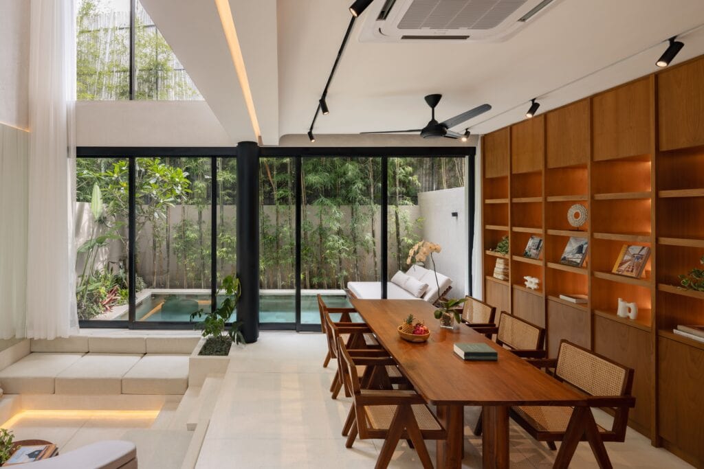 High-end modern minimalist decor with wooden accents and sliding glass doors.