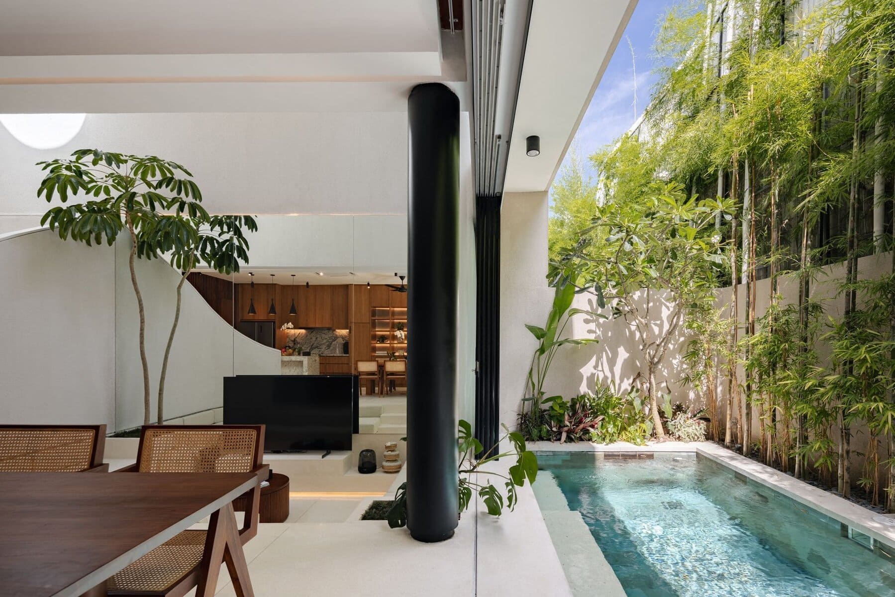Modern tropical villa featuring a private pool and lush garden in Canggu, Bali’s trendy destination.