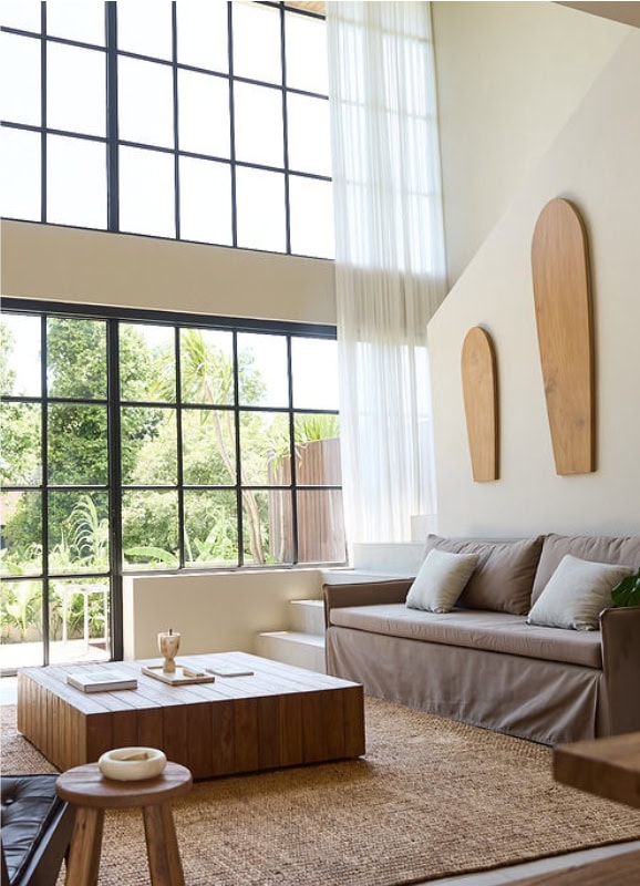 Bright, airy living room with minimalist decor and large windows for natural light.