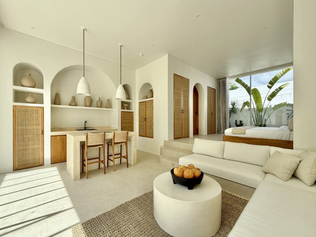 High-end Bali vacation rental with airy living space, stylish decor, and scenic outdoor ambiance.