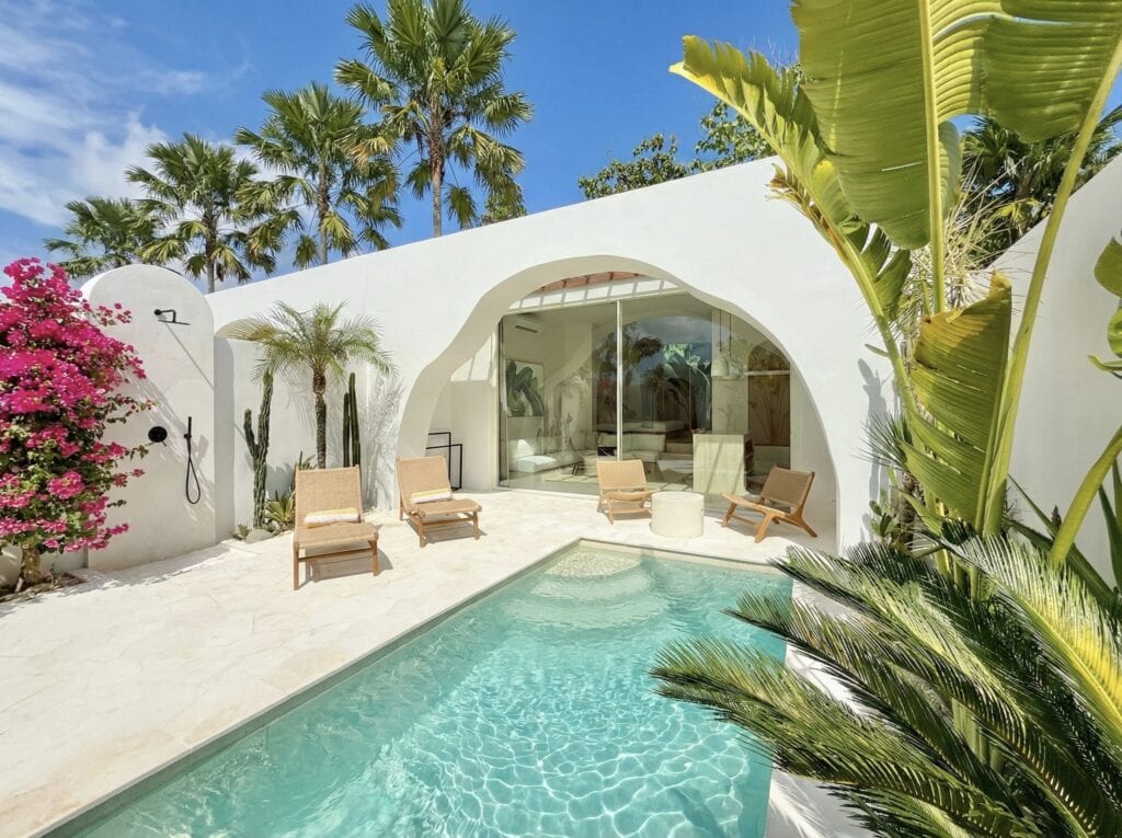 The Young Villas: Elegant tropical-modern villa with a private pool surrounded by lush greenery in U.