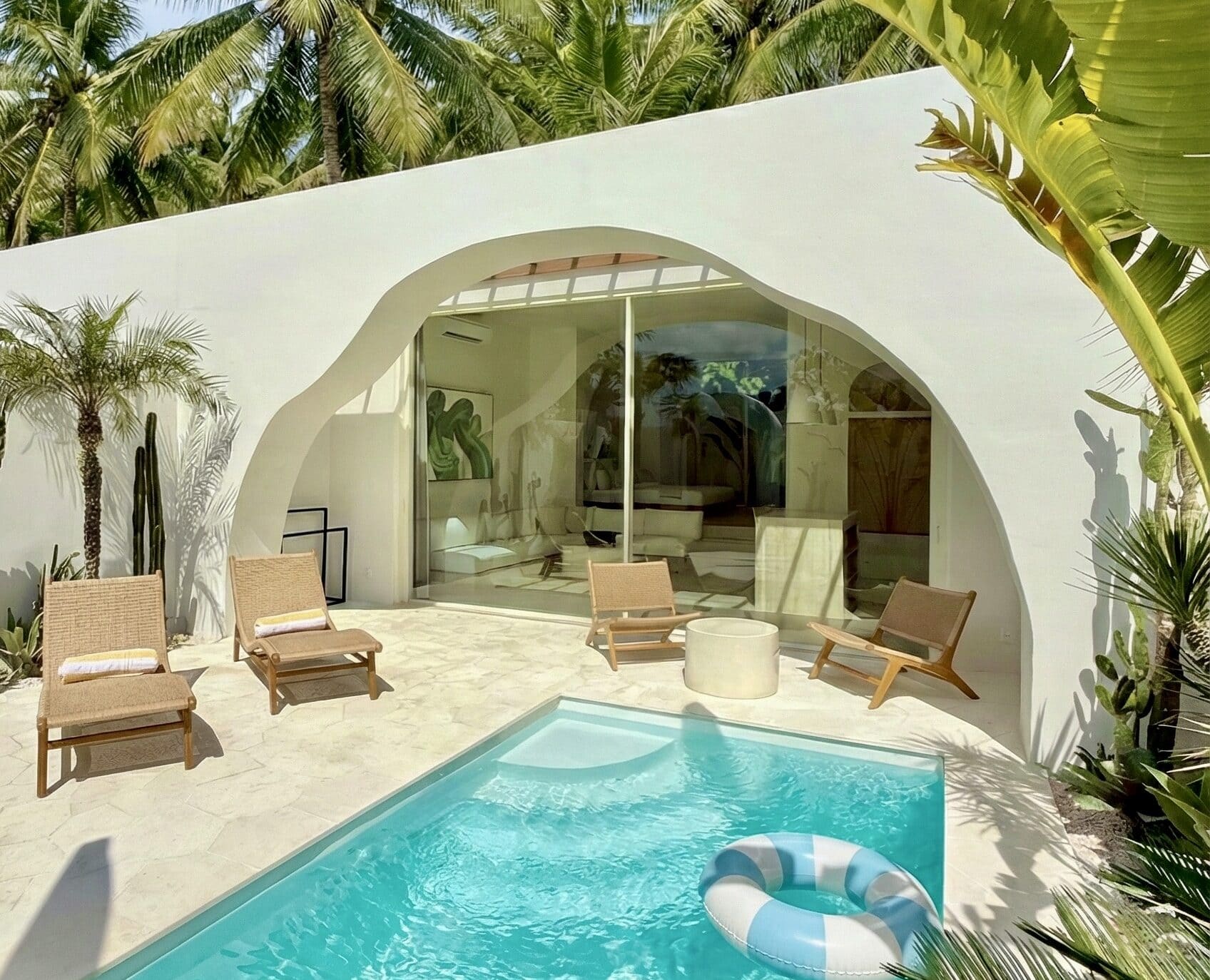 Luxury Bali villa rental featuring a private turquoise pool and sun deck