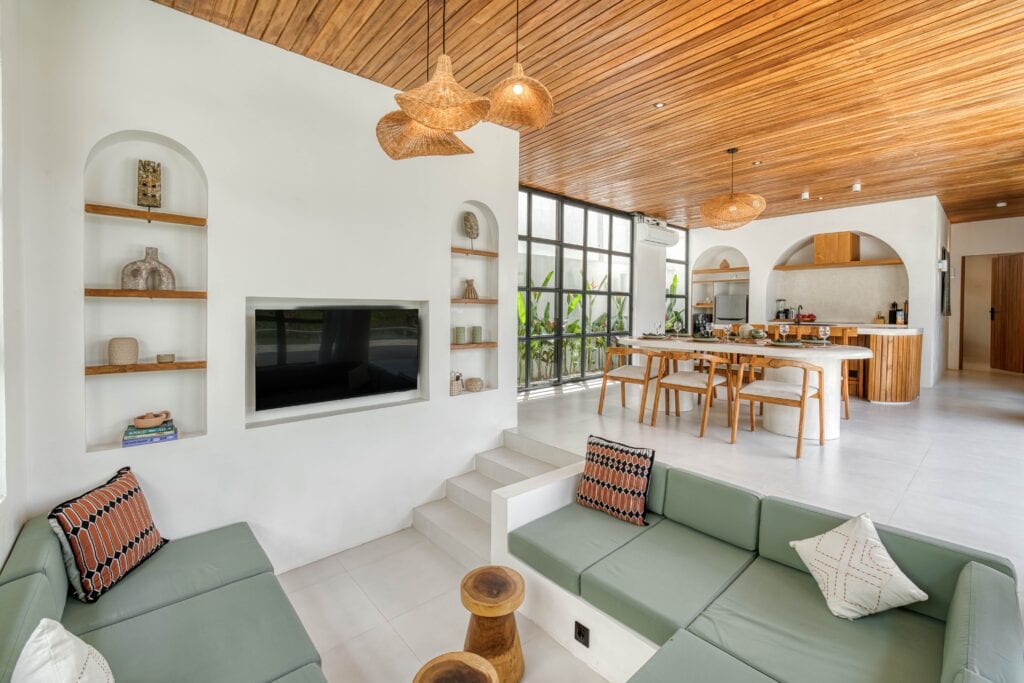 Luxury tropical-modern living room with minimalist design and natural materials in Bali.