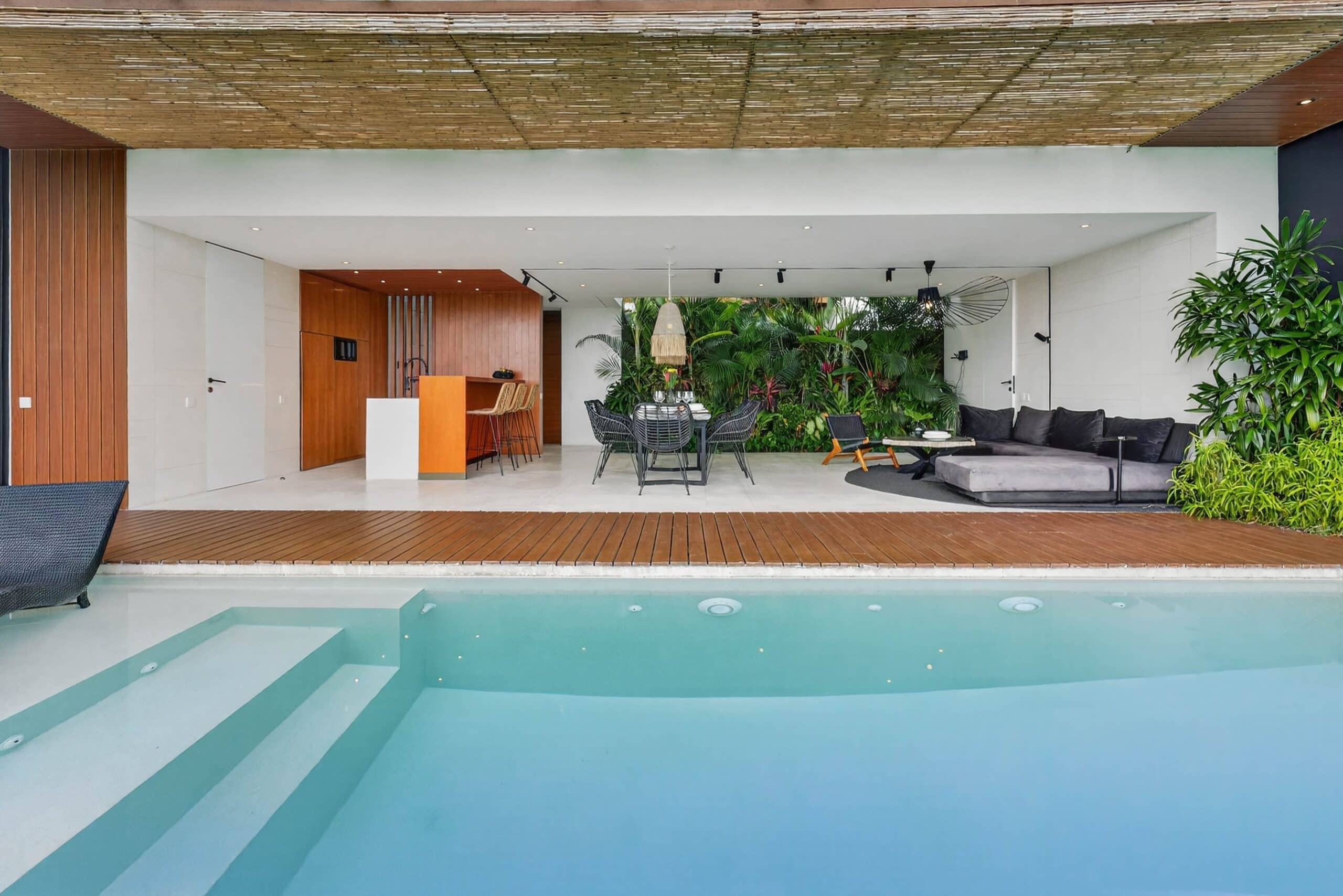 High-end infinity pool with modern outdoor living space in Canggu, Bali.
